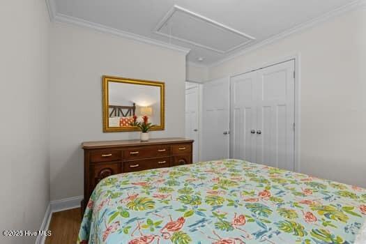 2011 Fisher St, Morehead City, NC 28557 - bedroom with ornamental molding and wood finished floors