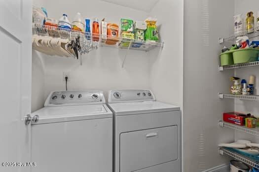 2011 Fisher St, Morehead City, NC 28557 - laundry room featuring washing machine and dryer and baseboards