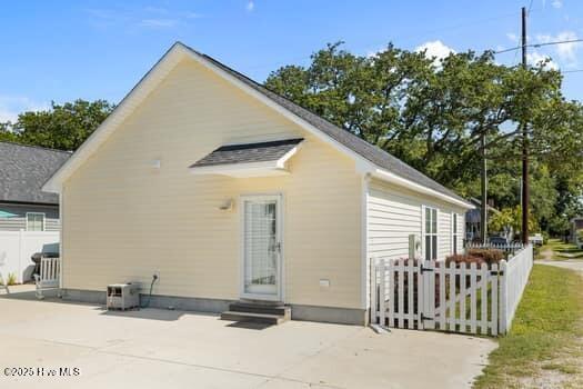 2011 Fisher St, Morehead City, NC 28557 - rear view of house with entry steps and a patio