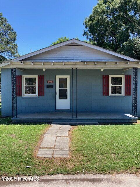 view of front of home with a front lawn and a porch