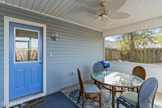 exterior space with a ceiling fan