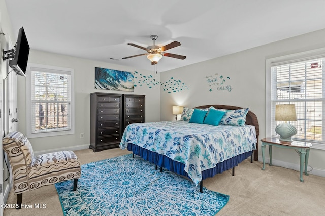 bedroom with carpet floors, visible vents, baseboards, and ceiling fan