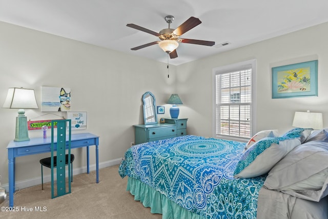 carpeted bedroom with baseboards and visible vents