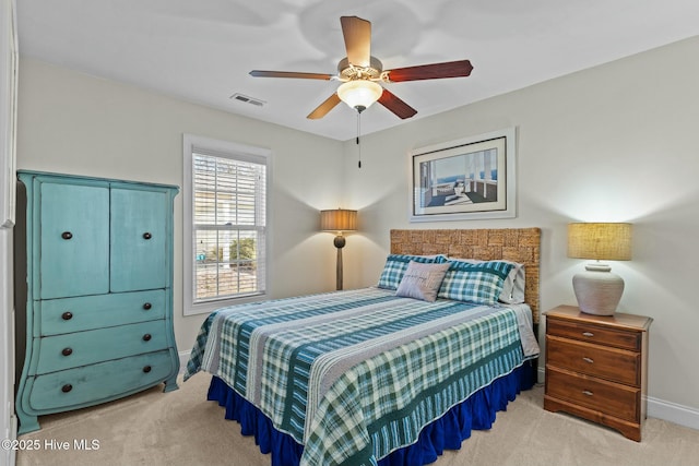 carpeted bedroom featuring baseboards, visible vents, and ceiling fan