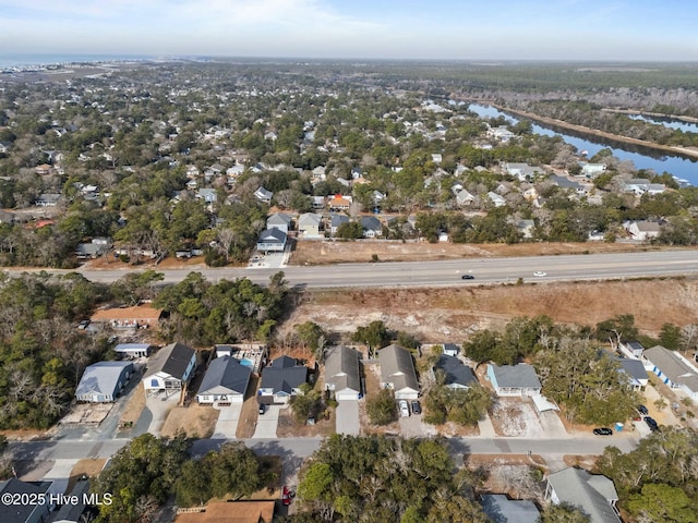 drone / aerial view featuring a water view and a residential view