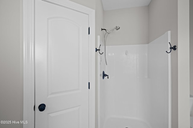 bathroom featuring walk in shower