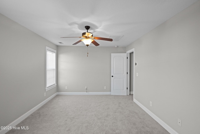 unfurnished room with light carpet and ceiling fan