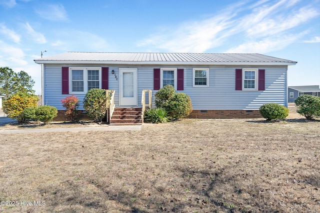 single story home with a front yard