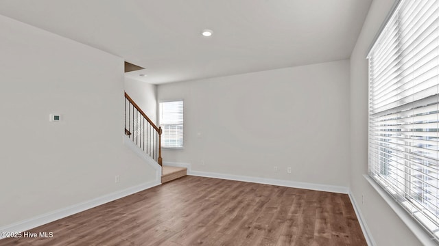 spare room featuring wood-type flooring