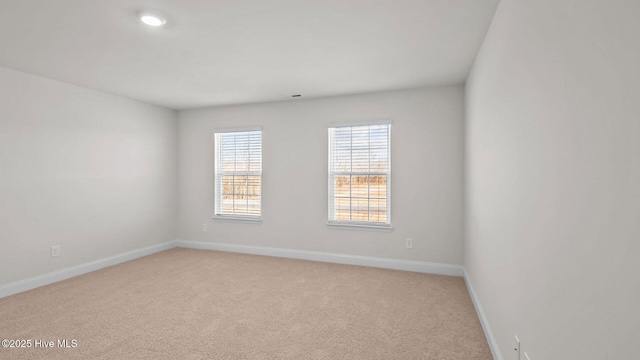 empty room featuring light carpet