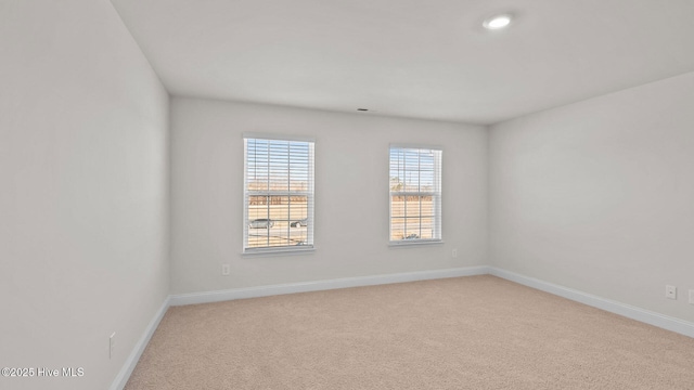 empty room featuring light carpet