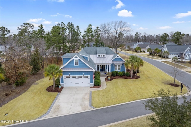 view of front of home featuring a front lawn and a garage