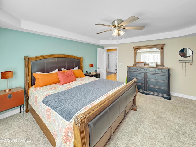 bedroom featuring baseboards, ceiling fan, and light colored carpet