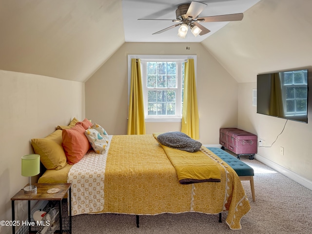 carpeted bedroom featuring lofted ceiling, ceiling fan, and baseboards