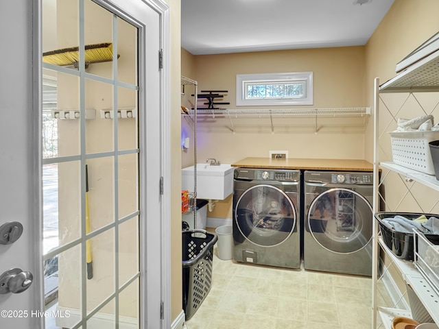 clothes washing area with laundry area and washing machine and clothes dryer