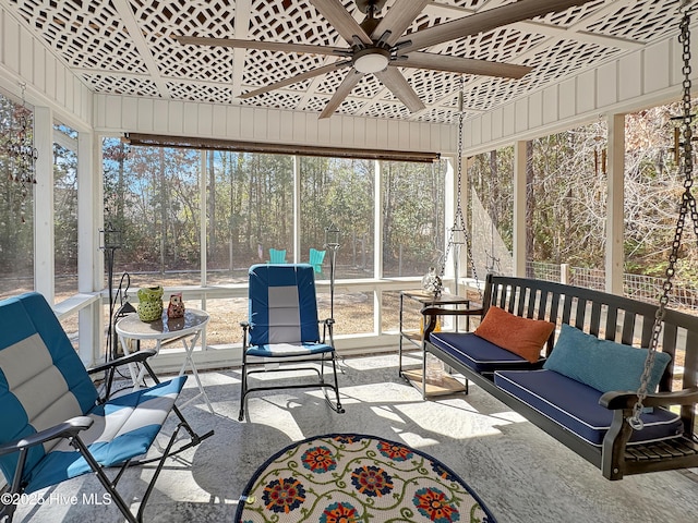 sunroom / solarium featuring ceiling fan