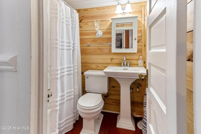 121 Dolphin Ln, Sneads Ferry, NC 28460 - full bath with toilet, curtained shower, wood walls, and a sink