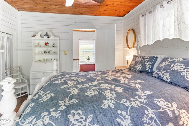 121 Dolphin Ln, Sneads Ferry, NC 28460 - bedroom featuring wooden ceiling, wooden walls, and ceiling fan
