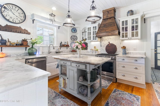 121 Dolphin Ln, Sneads Ferry, NC 28460 - kitchen with open shelves, appliances with stainless steel finishes, white cabinets, tasteful backsplash, and light wood-style flooring