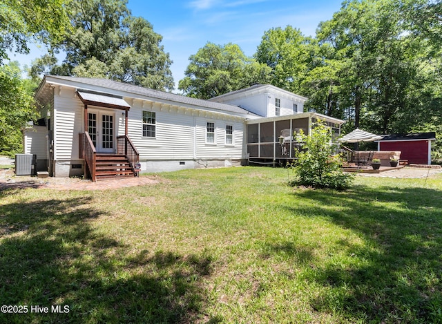 121 Dolphin Ln, Sneads Ferry, NC 28460 - back of property featuring crawl space, a sunroom, entry steps, central AC unit, and a yard