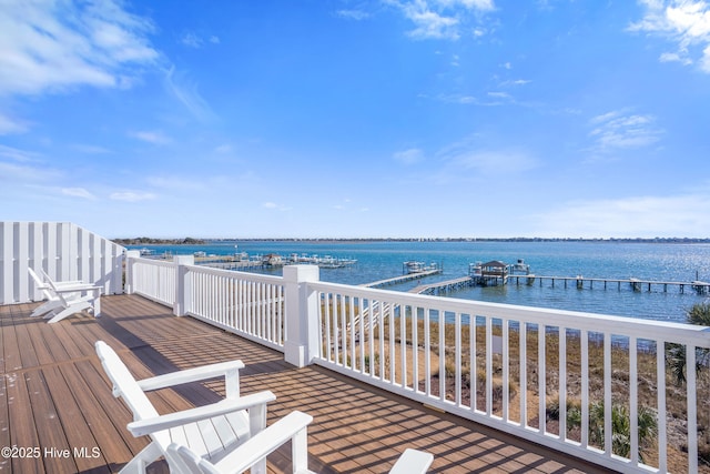 wooden terrace featuring a water view