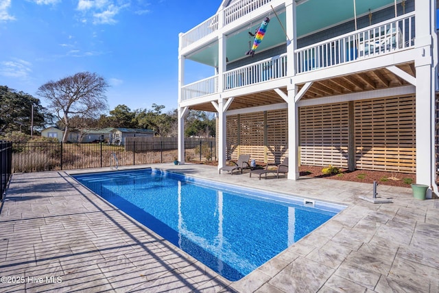 view of swimming pool with fence, a patio area, and a fenced in pool