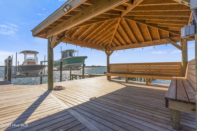 dock area featuring a water view and boat lift