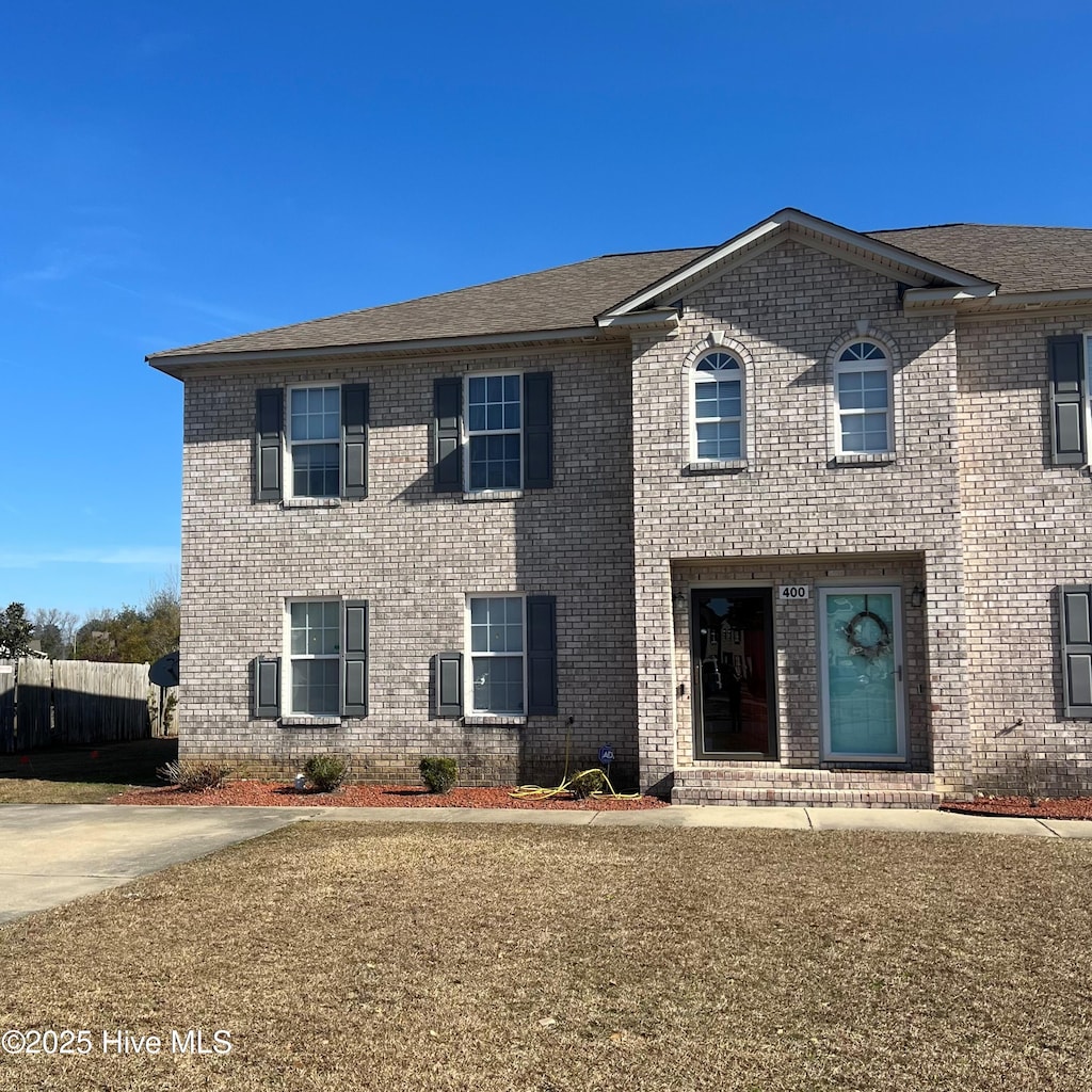 view of front of home with a front lawn