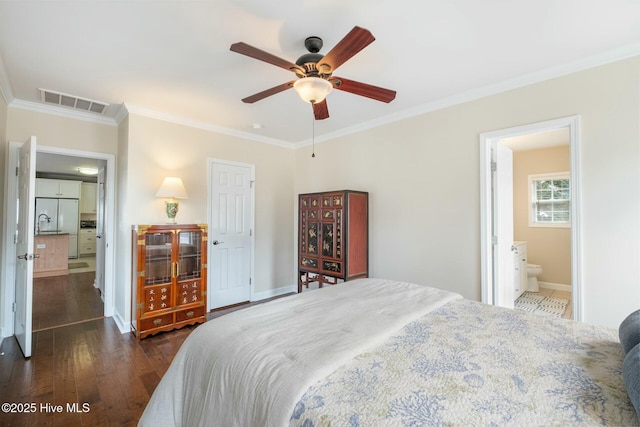 bedroom with visible vents, ornamental molding, baseboards, and hardwood / wood-style floors