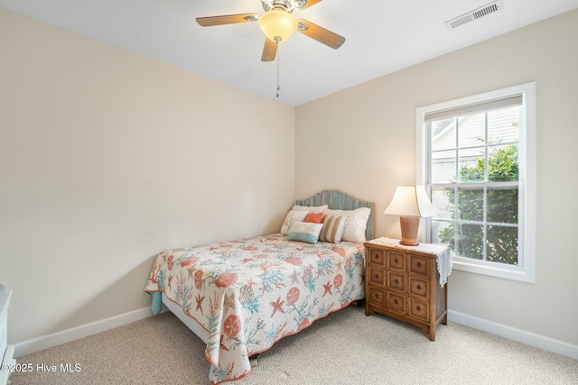 bedroom featuring a ceiling fan, baseboards, visible vents, and carpet floors