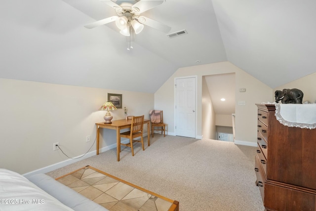 carpeted office featuring a ceiling fan, vaulted ceiling, baseboards, and visible vents