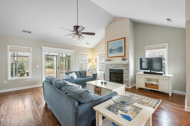 living area featuring visible vents, a ceiling fan, dark wood finished floors, a fireplace, and baseboards