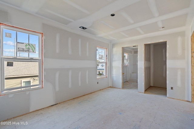 unfurnished bedroom featuring multiple windows