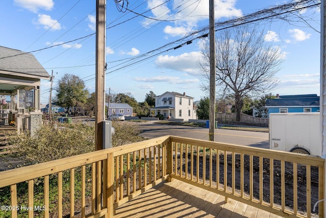 wooden deck featuring a residential view