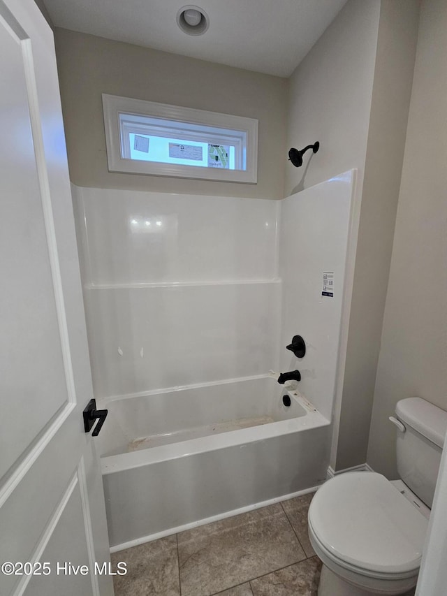 full bathroom featuring tile patterned flooring, shower / tub combination, and toilet