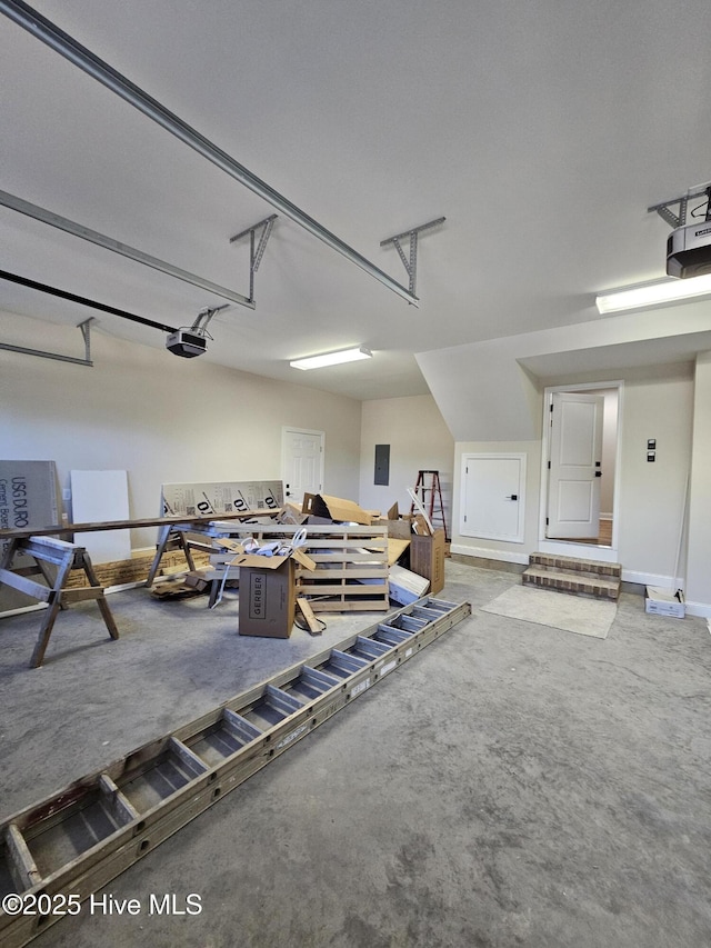 garage featuring a garage door opener and electric panel