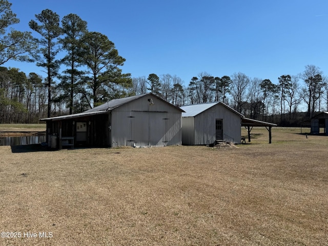 exterior space with a carport and a yard