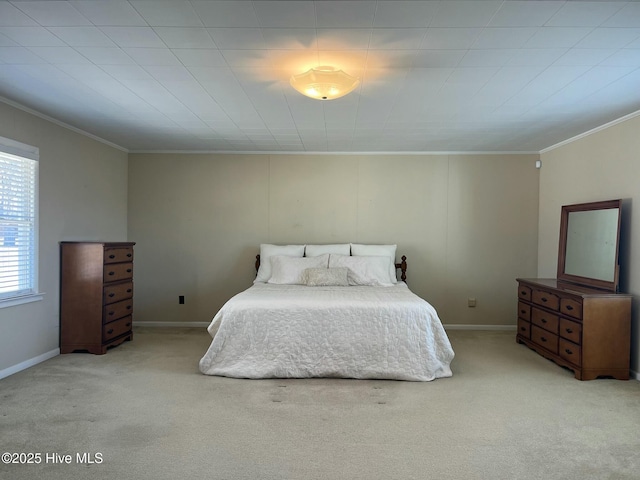 bedroom featuring baseboards, ornamental molding, and light colored carpet