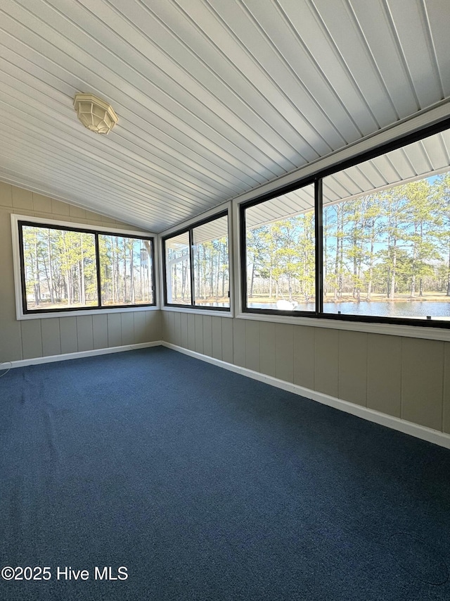 unfurnished sunroom with a water view and vaulted ceiling