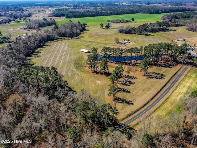 birds eye view of property with a rural view