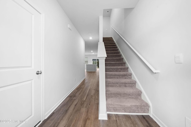 stairs featuring recessed lighting, wood finished floors, and baseboards