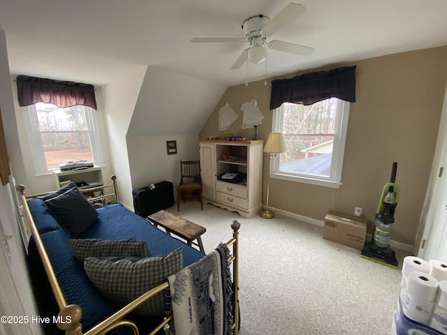 bedroom featuring carpet, lofted ceiling, and ceiling fan