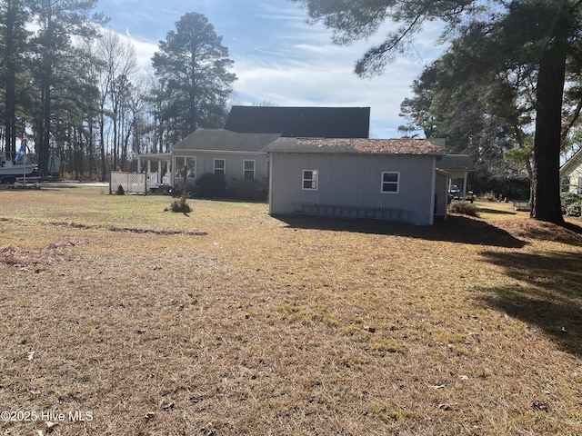 back of house with a yard