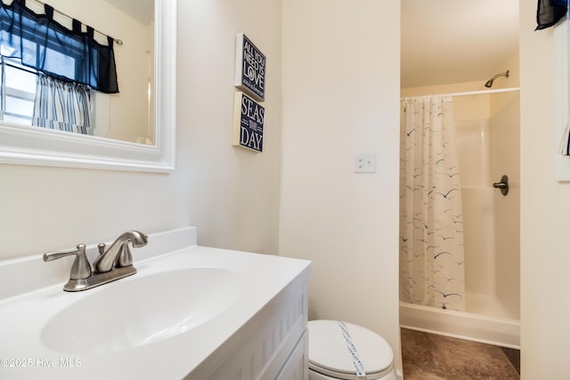 bathroom with tile patterned flooring, a shower with curtain, vanity, and toilet