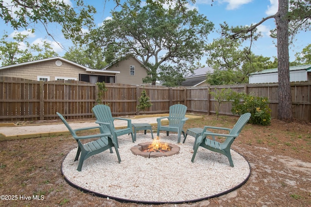 view of patio featuring a fire pit and a fenced backyard