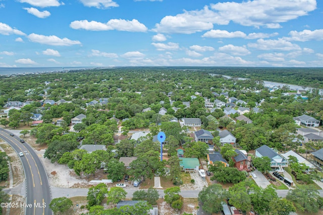 birds eye view of property featuring a residential view and a water view