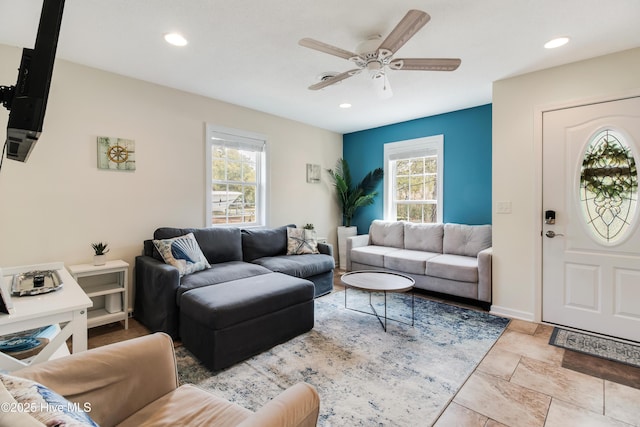 living room featuring recessed lighting, baseboards, and a ceiling fan