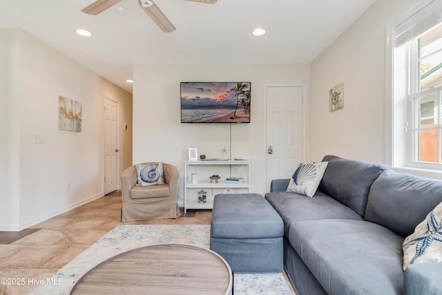 living area with recessed lighting, baseboards, plenty of natural light, and a ceiling fan