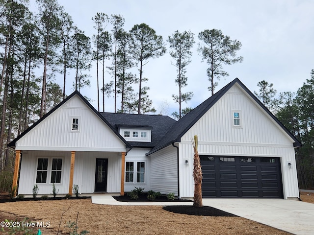 modern farmhouse with covered porch and a garage