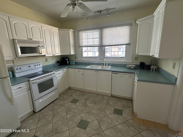 kitchen featuring ceiling fan, sink, white appliances, and white cabinetry